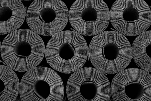 Roofing felt. Rolls of Bitumen Closeup of Rolls of new black roofing felt or bitumen. Shallow depth off field tar stock pictures, royalty-free photos & images