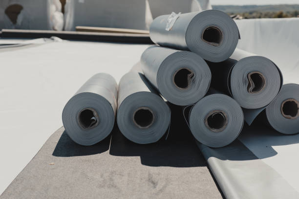 Roofing PVC membrane in rolls placed on the roof of a hall.Rubber membrane ready. Roofing PVC membrane in rolls placed on the roof of a hall.Rubber membrane ready. membrane stock pictures, royalty-free photos & images