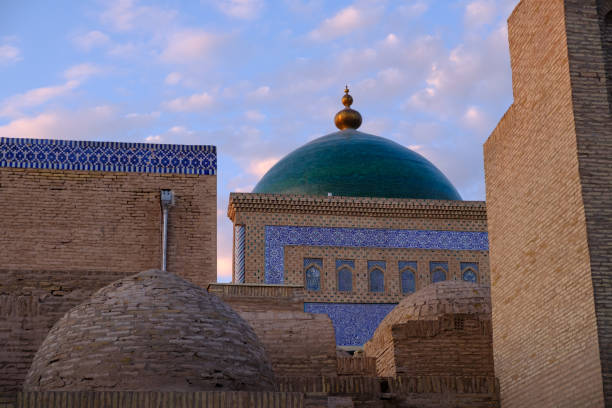 Roofs and cupolas of old town in sunset light, in Khiva, Uzbekistan. stock photo