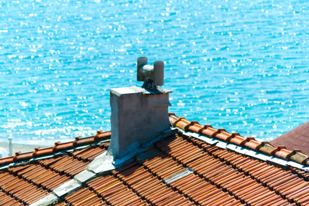 Rooftop chimney by the seaside stock photo