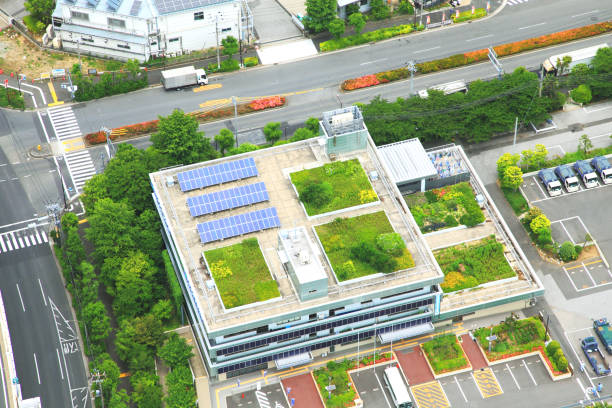 Rooftop gardens Tokyo high-rise buildings with solar power panels Rooftop gardens Tokyo high-rise buildings with solar power panels roof garden stock pictures, royalty-free photos & images