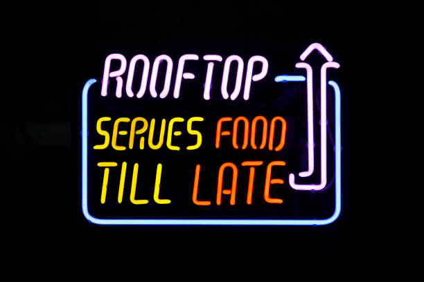 Rooftop serves food till late - Neon light stock photo
