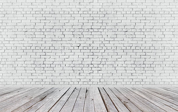 room interior with white brick wall and wood floor mockup stock photo