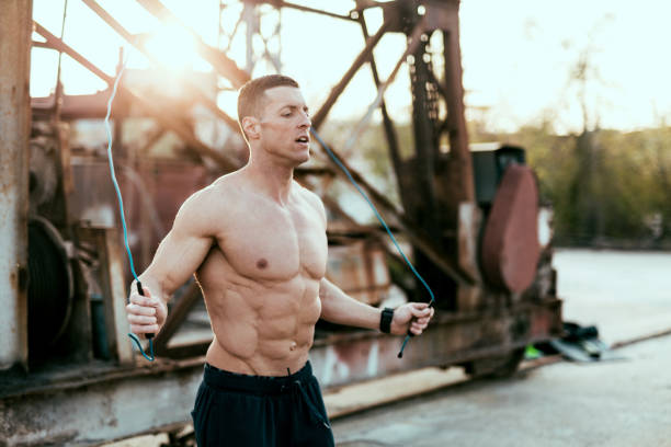 Rope jumping Young man exercising jump rope stock pictures, royalty-free photos & images