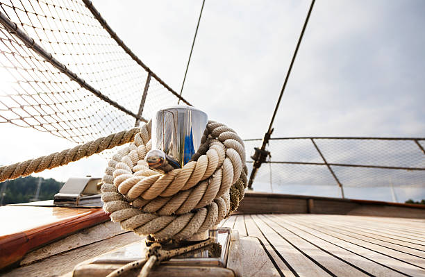 Rope tighten on Cleat. Hawser. Sailing Yacht. Hawser. Deck. stock photo