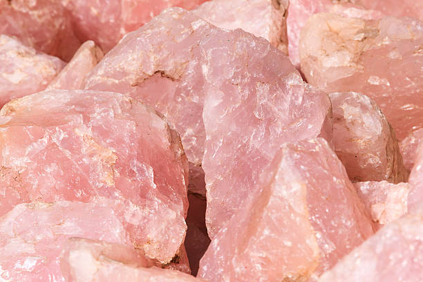 Rose quartz Raw rocks of Rose quartz, found in Madagascar rose quartz stock pictures, royalty-free photos & images