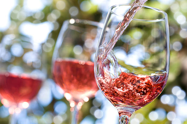 rose wine alfresco - gieten stockfoto's en -beelden