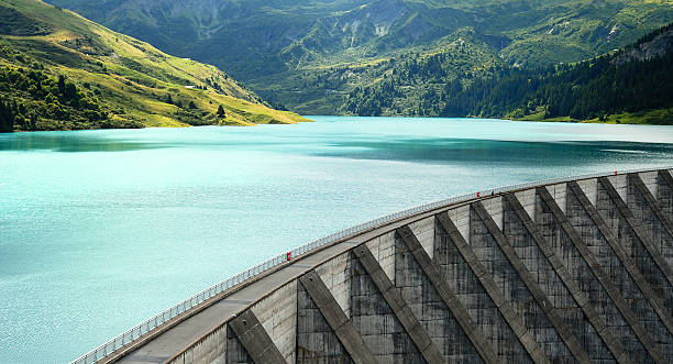 Roselend weir famous Roselend dam in french alps, Savoy, France dam stock pictures, royalty-free photos & images