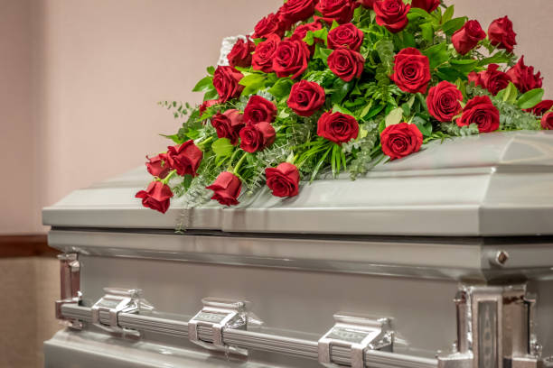 Roses on Top of Funeral Casket Roses on Top of Funeral Casket funeral stock pictures, royalty-free photos & images