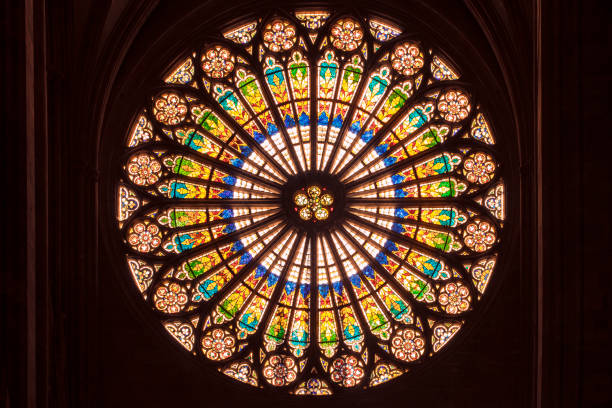 Rosette, huge beautiful stained glass window by the interior of notre dame cathedral in Strasbourg. Stained glass window, rose window in a shape of circle inside the Notre Dame Cathedral in Strasbourg. Mandala window. notre dame de strasbourg stock pictures, royalty-free photos & images