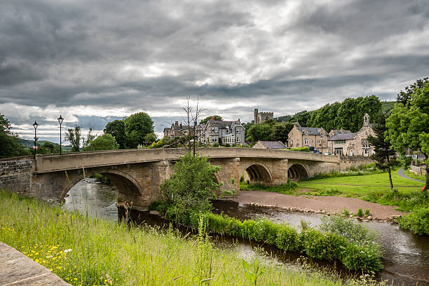 Rothbury Town and bridge The road bridge over the River Coquet leads into the town of Rothbury, Northumberland rothbury northumberland stock pictures, royalty-free photos & images