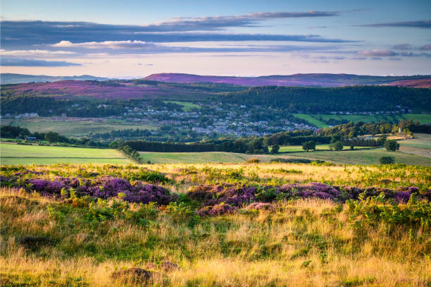 Rothbury Town from Lordenshaws Hillfort Lordenshaws Hillfort is located near Rothbury in Northumberland National Park with heather covered hills beyond rothbury northumberland stock pictures, royalty-free photos & images