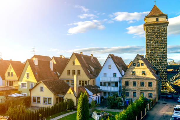 Rothenburg ob der Tauber, Germany. Top view of picturesque town on bright blue sky copy space background. Nice cottages with steep roofs, high stone tower and clean green streets on sunny summer day. Rothenburg ob der Tauber, Germany. Top view of picturesque town on bright blue sky copy space background. Nice cottages with steep roofs, high stone tower and clean green streets on sunny summer day. rottenburg am neckar stock pictures, royalty-free photos & images