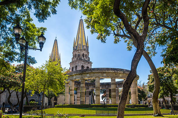Rotonda de los Jalisciences Ilustres and Cathedral, Guadalajara, Jalisco, Mexico stock photo