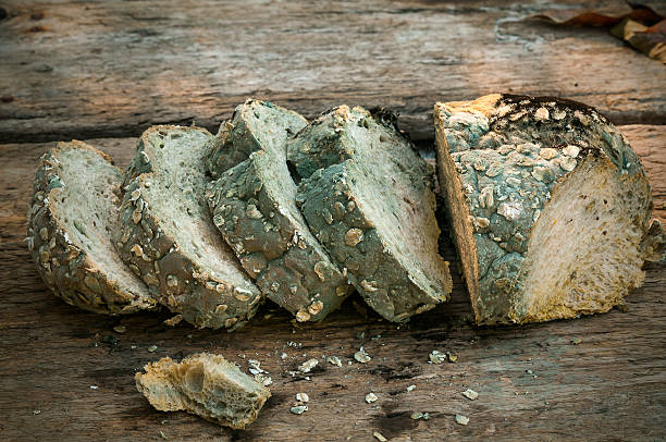 Rotten bread,put on a wooden table,Thailand stock photo