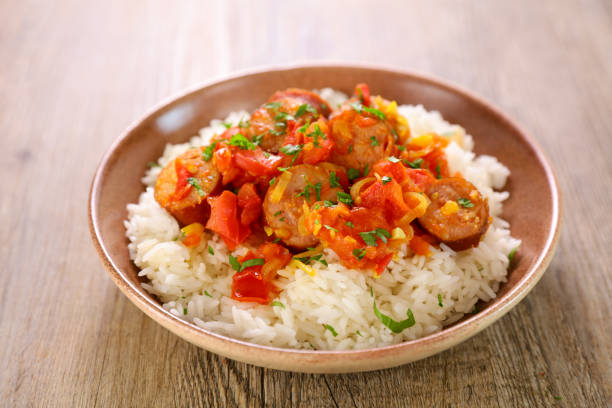 rougail saucisse- creole dish with rice and spicy sausage stock photo