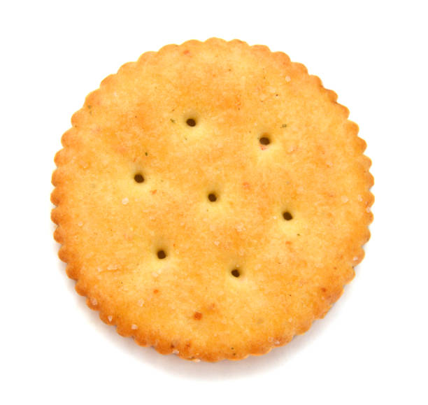 Round Cracker isolated on white with a clipping path. Round Cracker isolated on white with a clipping path. cracker snack photos stock pictures, royalty-free photos & images