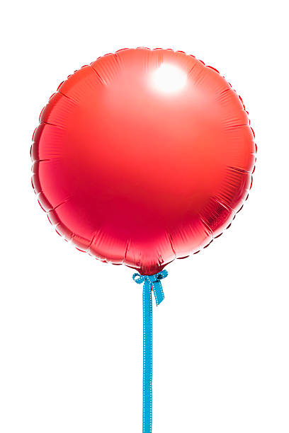 Round red helium balloon on blue cord stock photo