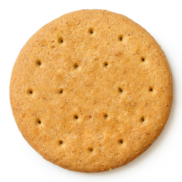 Round sweetmeal digestive biscuit isolated from above. Round sweetmeal digestive biscuit isolated from above. 7 grain bread photos stock pictures, royalty-free photos & images