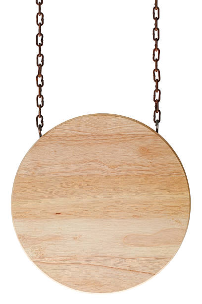 Round wood sign board hanging from old chains. stock photo