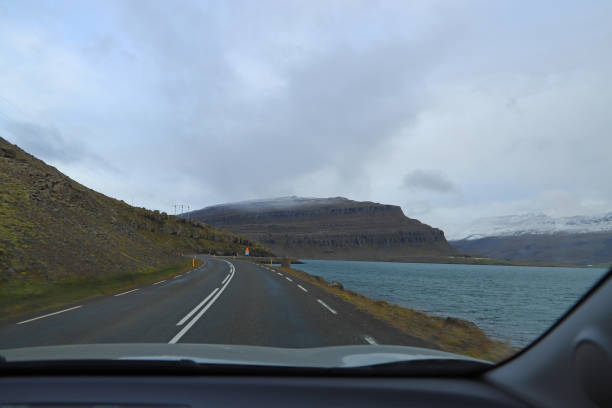 Route 1 or the Ring Road and Berufjordur fjord. View from a car window while driving stock photo