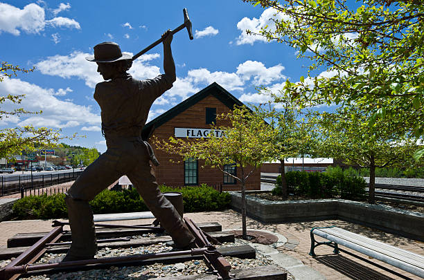 Route 66 Flagstaff, Arizona, U.S.A. - May 24, 2011: A sculpture representing a worker of the tracks of the railway line, along the Route 66. coconino county stock pictures, royalty-free photos & images