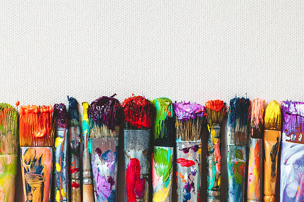 row of artist paintbrushes closeup on canvas. - 藝術 個照片及圖片檔