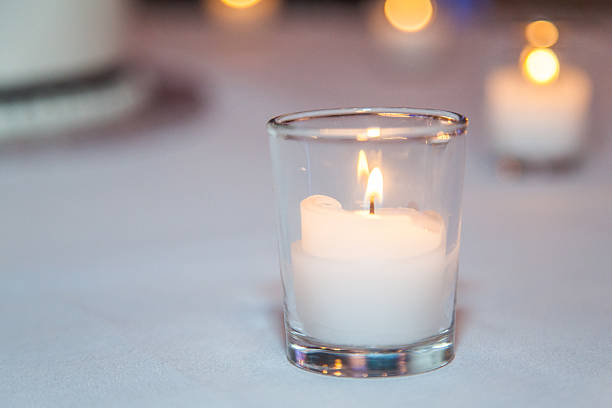 Row of Candles on Table stock photo