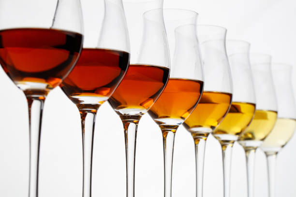 Row of cognac glasses with different stages of aging stock photo