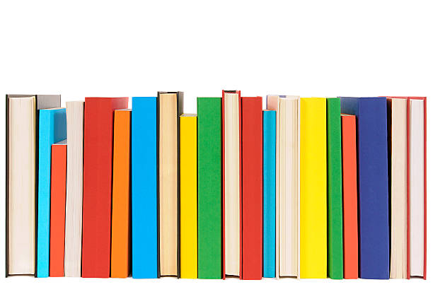 Row of colorful library books isolated on white background . stock photo