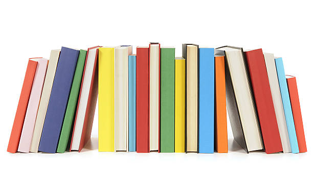 Row of colorful paperback books stock photo