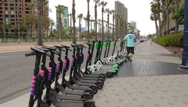 Row of electric dockless scooters from Lyft stock photo