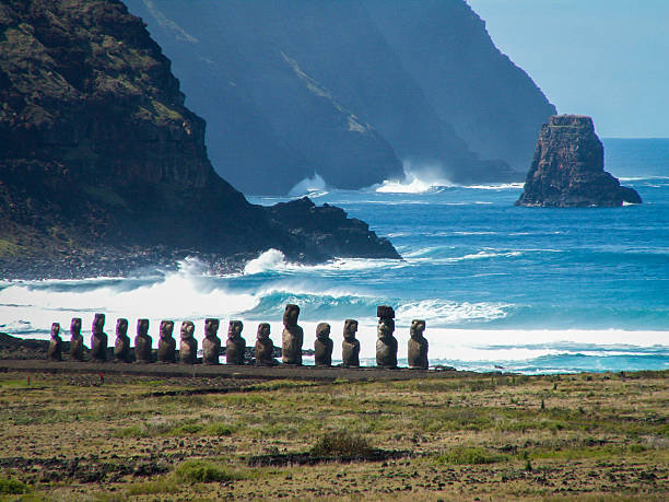 Row Of Moai By Sea Landscape Close A row of moai on an ahu near the coast of Easter Island. rapa nui stock pictures, royalty-free photos & images