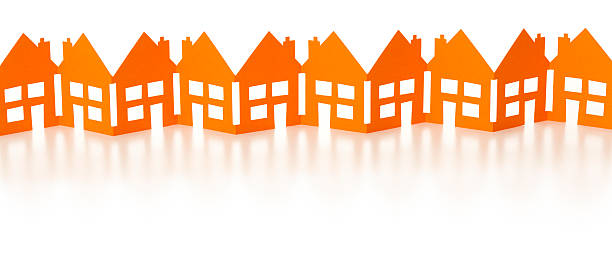 Row of orange paper chain houses stock photo