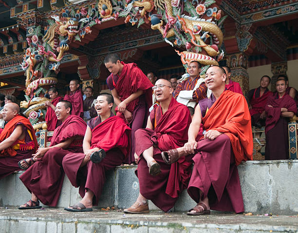 Row of Smiling Monks in Bhutan stock photo