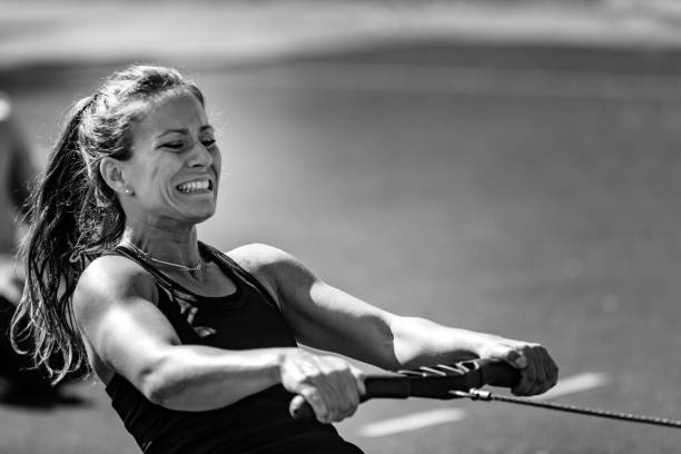 Rowing machine workout Rowing machine workout, black and white toughness stock pictures, royalty-free photos & images