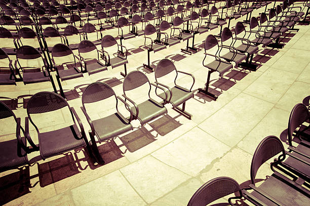 Rows of chairs at outdoors concert hall. Vintage style processing...