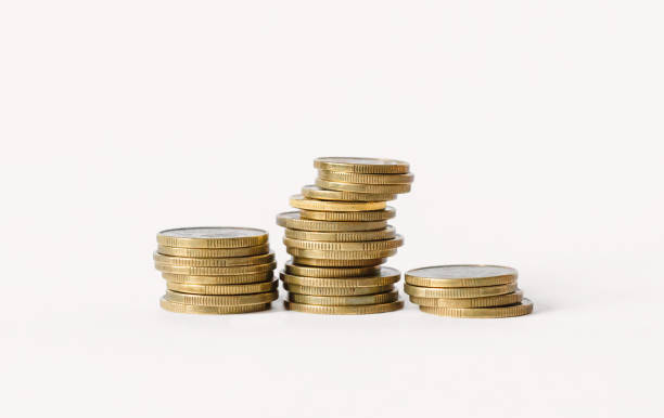 Rows of coins isolated on white background. Finance and banking concept. stock photo
