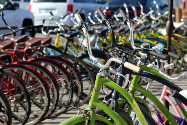 rows of colorful bicycles outdoors stock photo