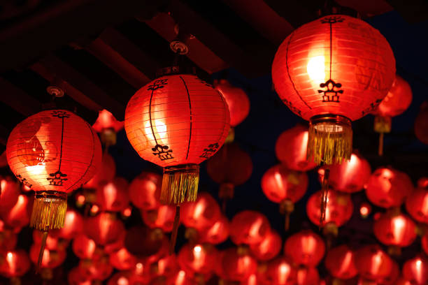 Rows of colorful glowing red Chinese lanterns Rows of colorful glowing red Chinese lanterns hanging high at temple ground during Chinese New Year Celebrations at Thean Hou Temple, Kuala Lumpur Malaysia. chinese lantern stock pictures, royalty-free photos & images