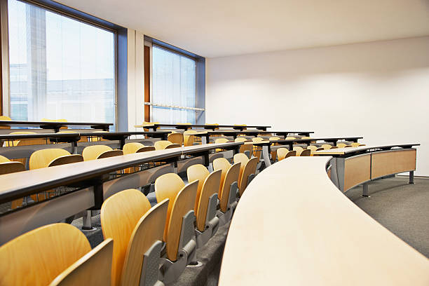 Rows of folding chairs and tables  lecture hall stock pictures, royalty-free photos & images