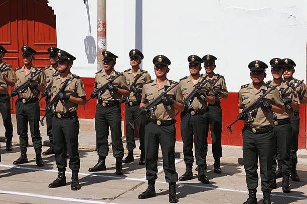 Rows of Policemen with Machine Guns in Peru stock photo