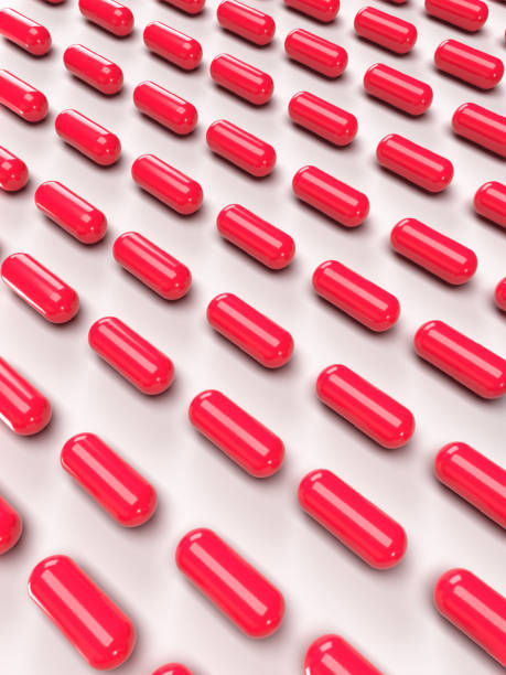 Rows of red pills stock photo