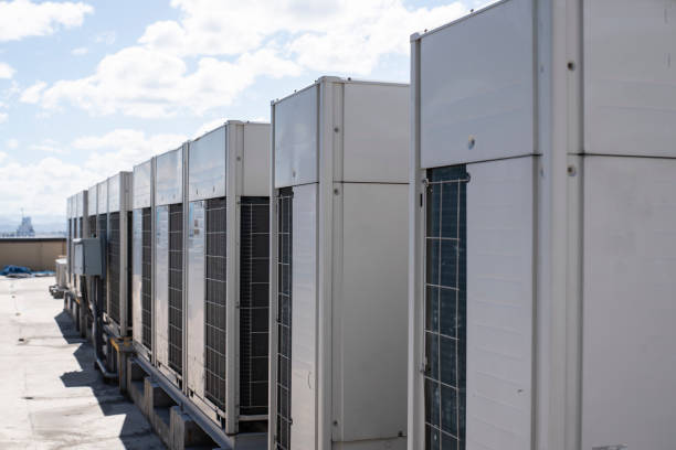 Rows of rooftop HVACs on the roofdeck of an office tower. VRF air conditioner for commercial buildings stock photo