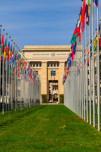 Rows of the United Nations member states flags in a front of Palace of United Nations in Geneva, Switzerland Geneva, Switzerland - April 11, 2022: Rows of the United Nations member states flags in a front of Palace of United Nations in Geneva, Switzerland unesco organised group stock pictures, royalty-free photos & images