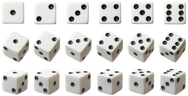 3 rows of white dice each set at different angles stock photo