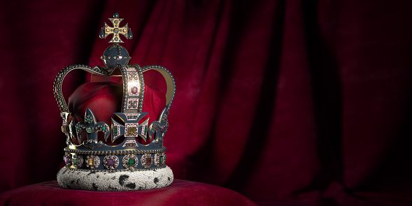 Royal golden crown with jewels on pillow on pink red background. Symbols of UK United Kingdom monarchy. 3d illustration