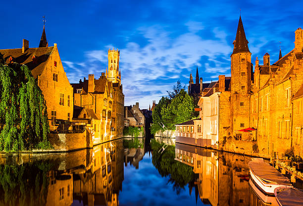 Rozenhoedkaai, Bruges in Belgium Bruges, Belgium. Image with Rozenhoedkaai in Brugge, Dijver river canal twilight and Belfort (Belfry) tower. brugge belgium stock pictures, royalty-free photos & images