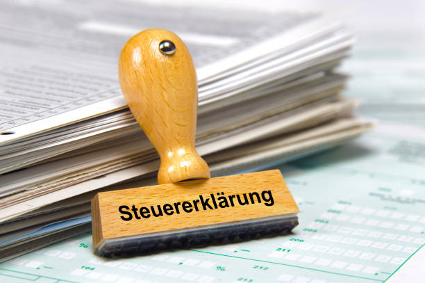 rubber stamp printed with German word Steuererklärung on it: in English - Tax declaration stock photo