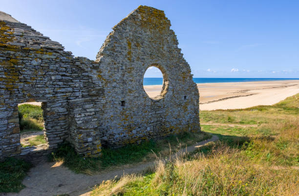 Ruins of an ancient church in the cliffs on the Cape Carteret. Barneville-Carteret, Normandy, France Normandy, France - August 25, 2018: Ruins of an ancient church in the cliffs on the Cape Carteret. Barneville-Carteret, Normandy, France barneville carteret stock pictures, royalty-free photos & images